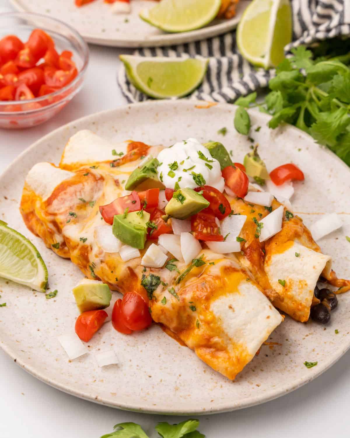 two enchiladas on a plate.