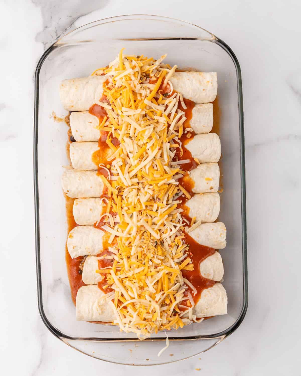 sauce and cheese over the turkey enchiladas.