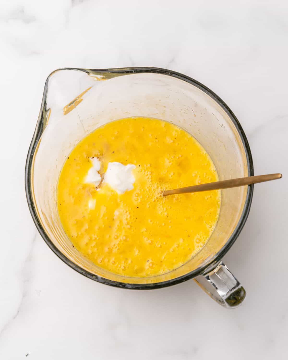 yogurt in with the egg mixture in a bowl.