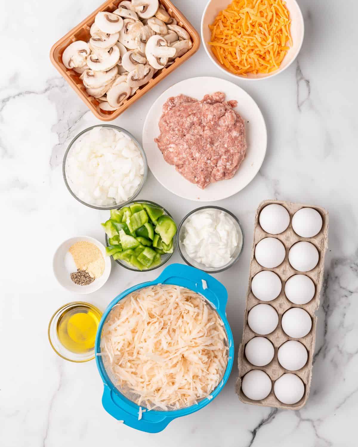 ingredients to make overnight sausage hash brown casserole.