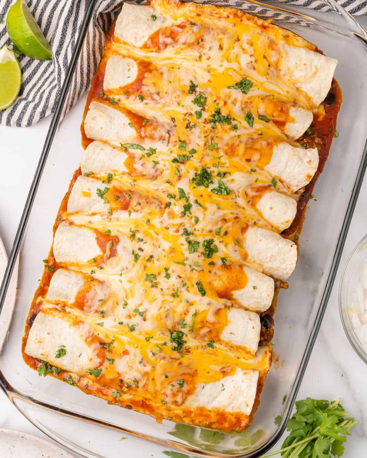 overhead picture of turkey enchiladas in a glass pan.
