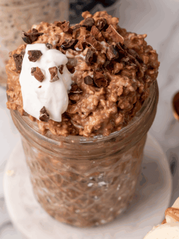 Healthy chocolate overnight oats with yogurt, protein, and fiber in a glass jar. Perfect for quick,.