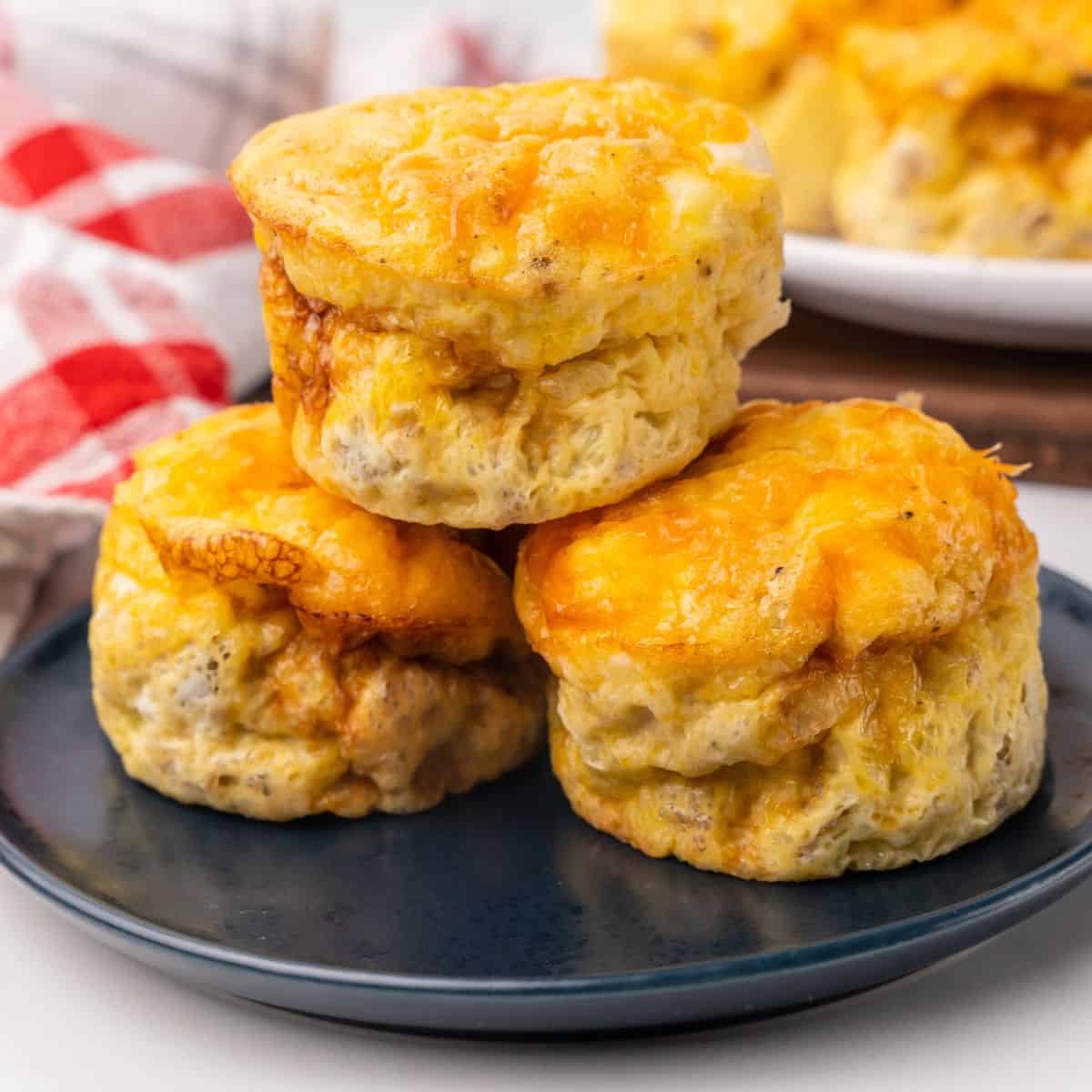 closeup of sausage egg muffins on a plate.