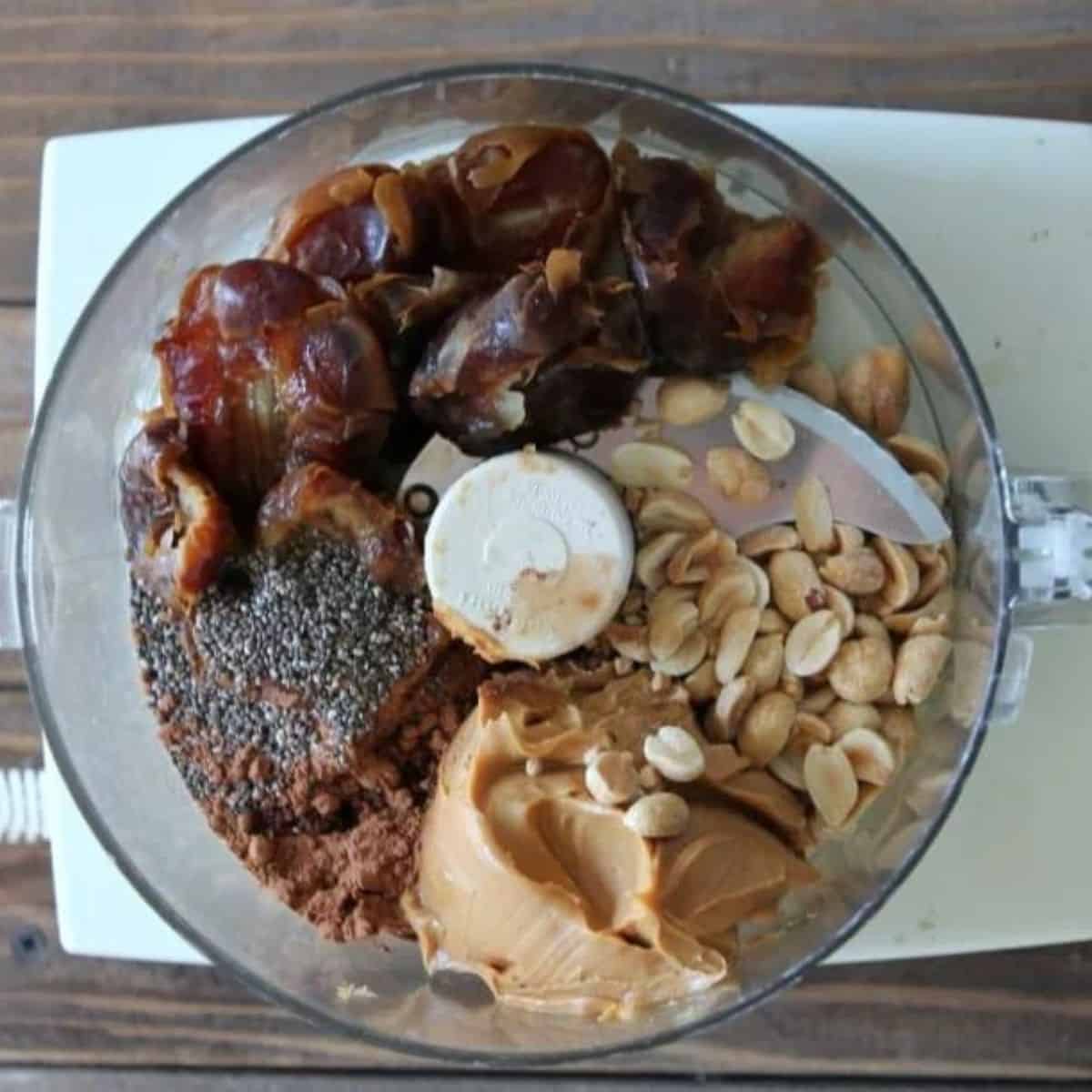 chocolate protein ball ingredients in a food processor.
