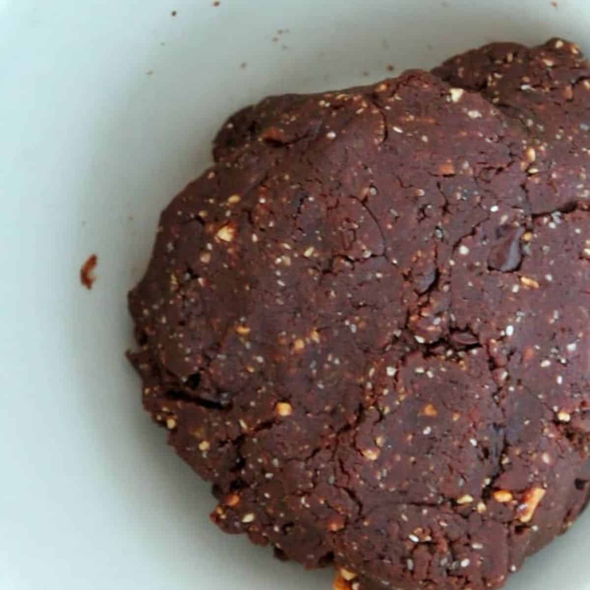 peanut butter chocolate protein ball dough in a bowl.