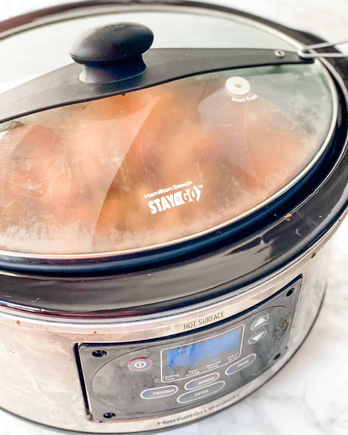 covered slow cooker with ground turkey chili.