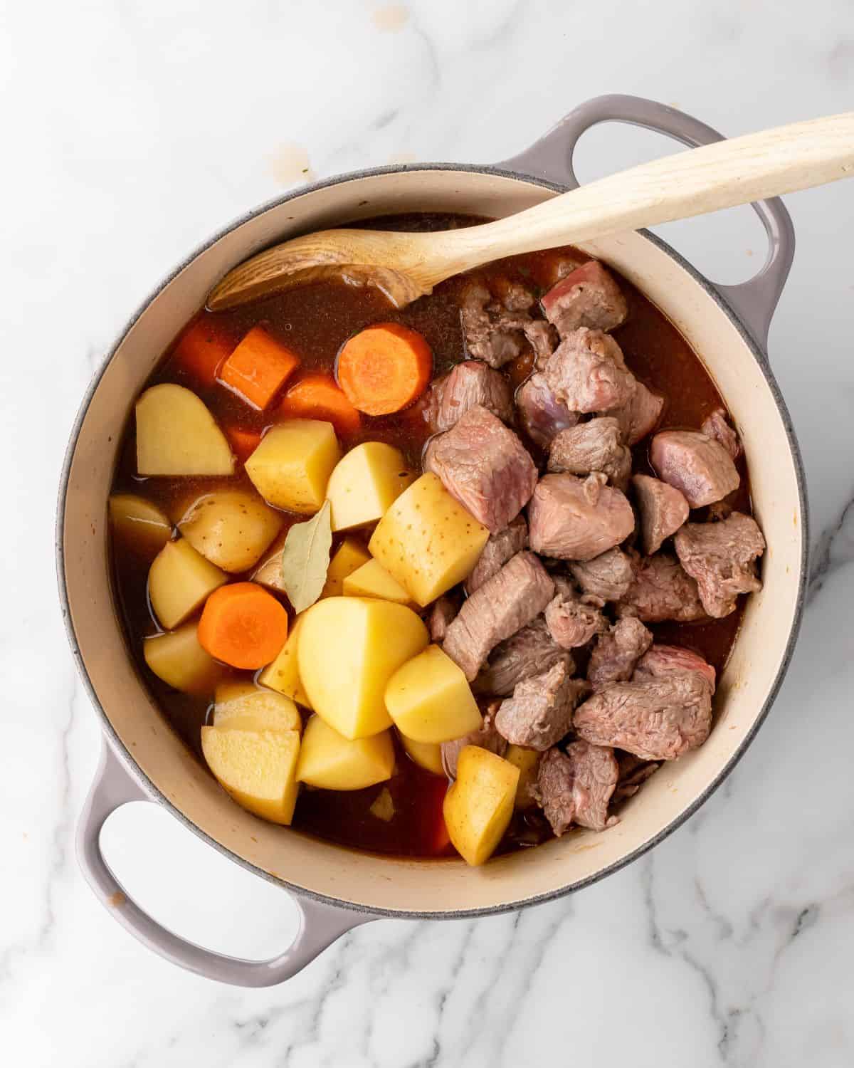 potatoes, carrots, and beef in with the liquid.