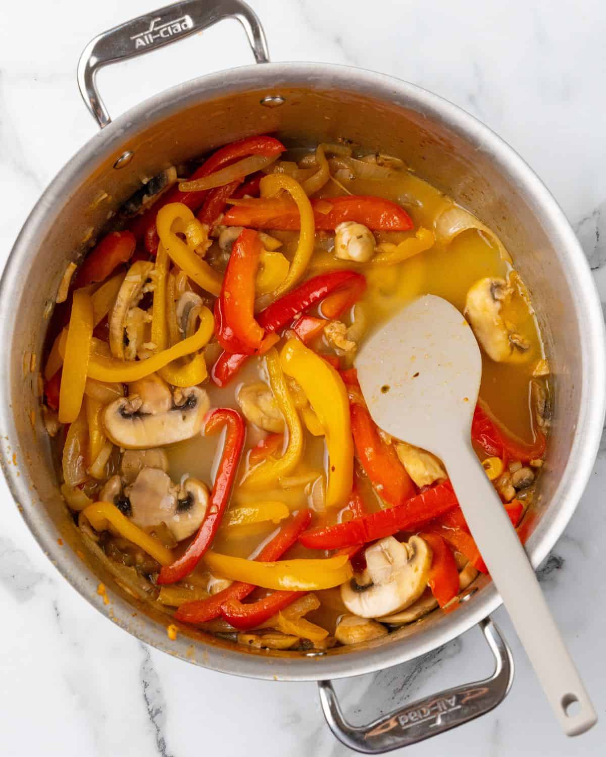 chicken stock in with the veggies in the pot.