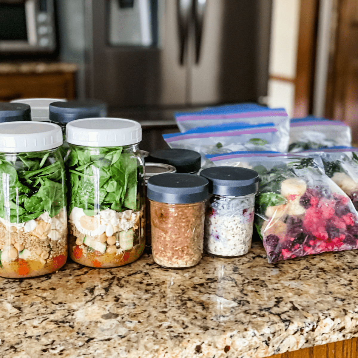 meal prep for weight loss. meal prep meals on a kitchen counter.