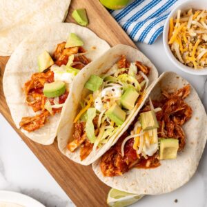 overhead picture of slow cooker shredded chicken tacos.