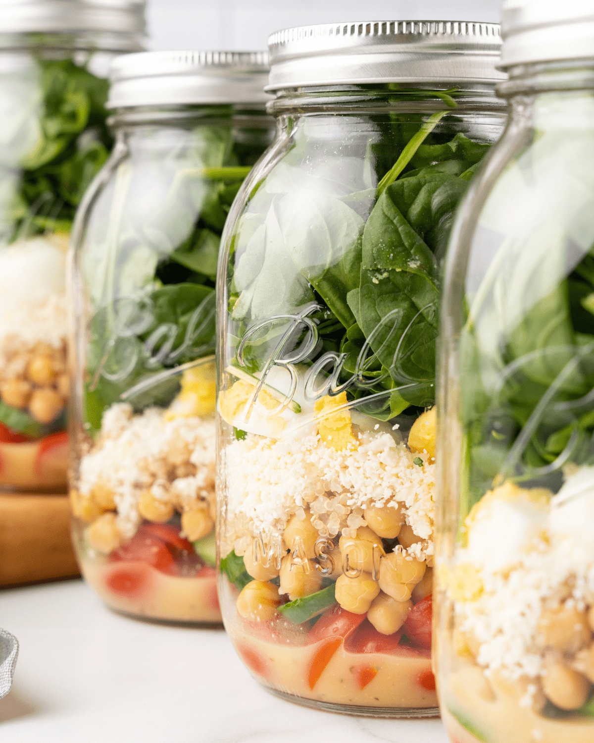 protein power mason jar salads in a row.