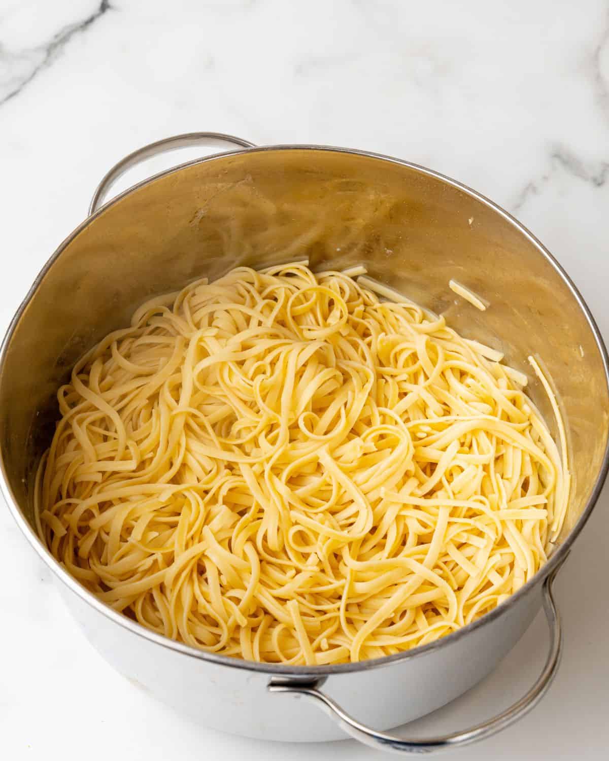 cooked linguine pasta in a pot.
