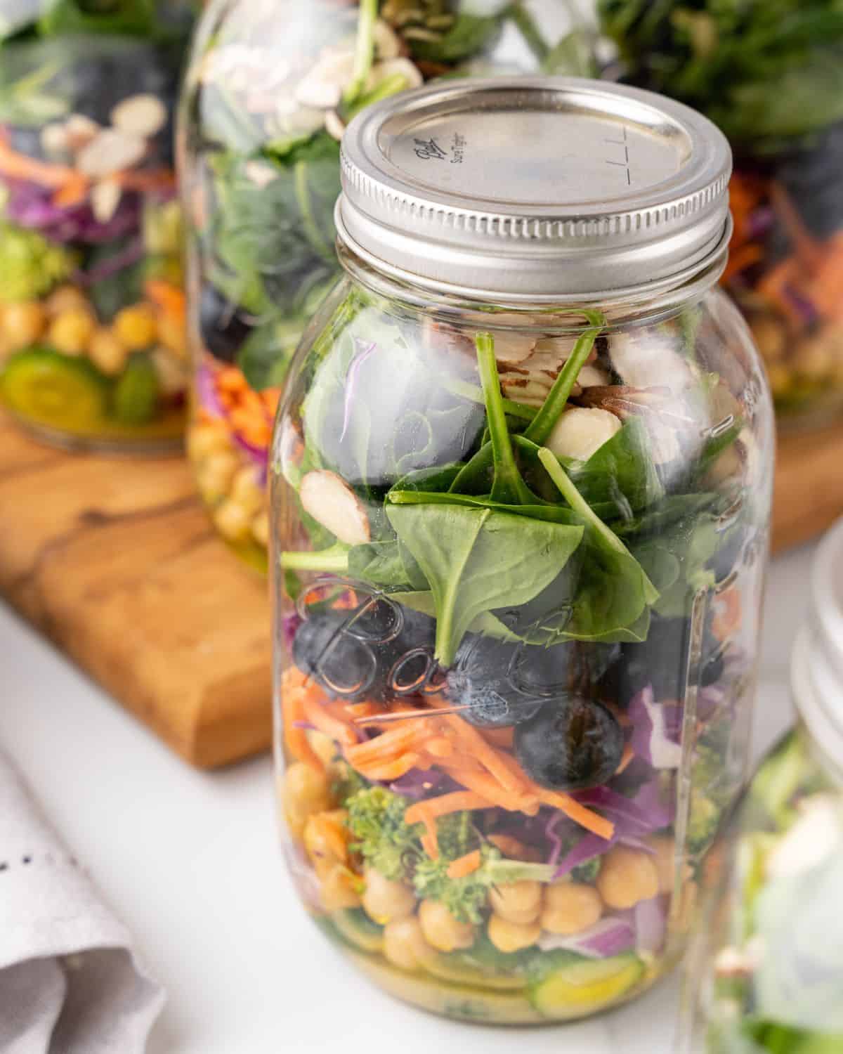 close-up view of detox mason jar salad.