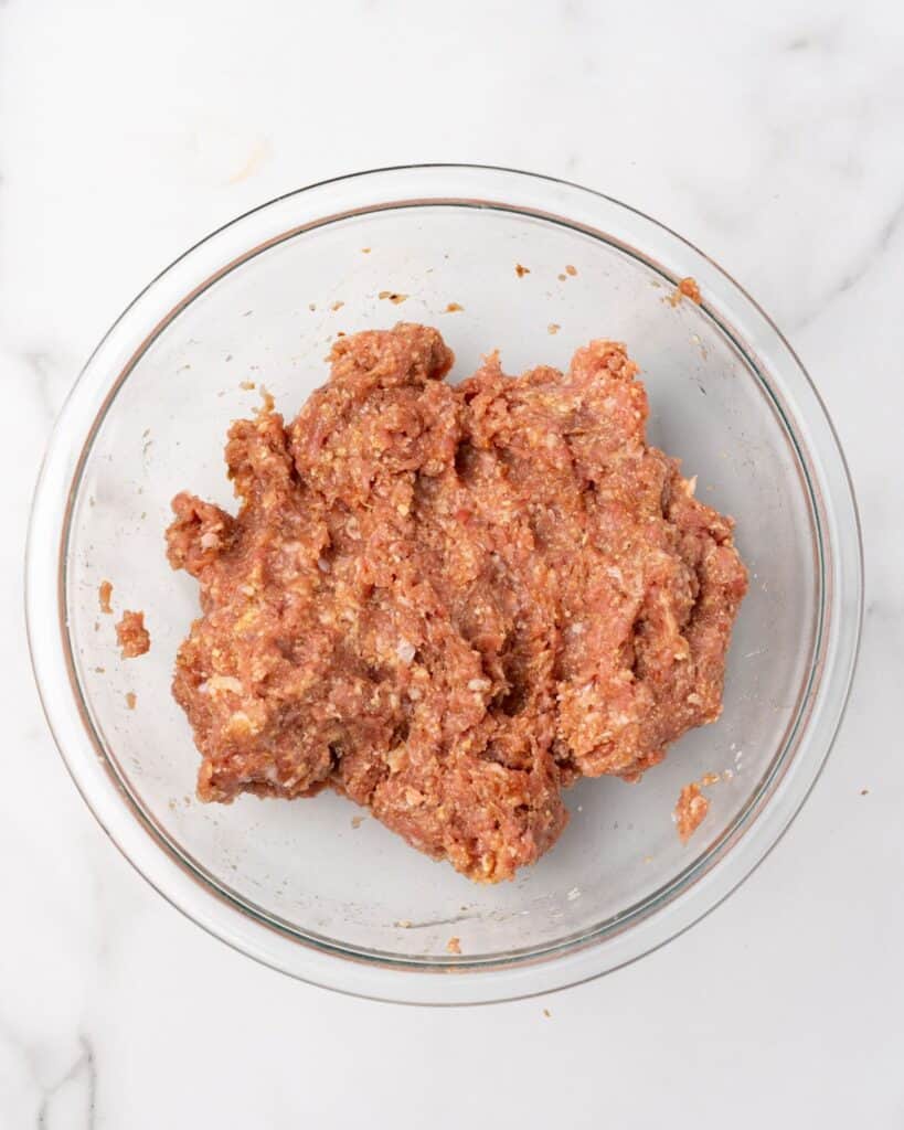 meatball ingredients mixed in a large bowl.