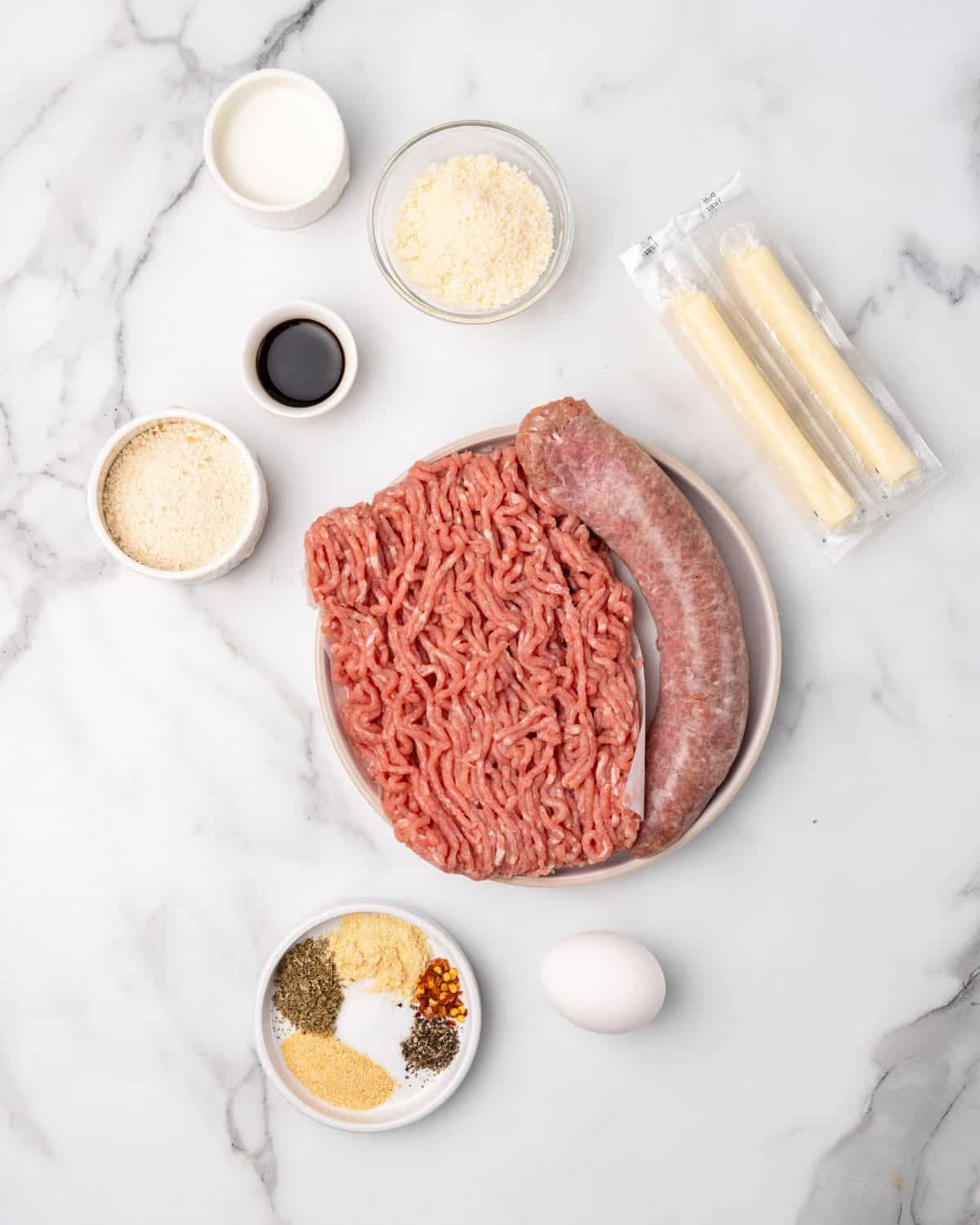 Ingredients to make cheese stuffed meatballs.