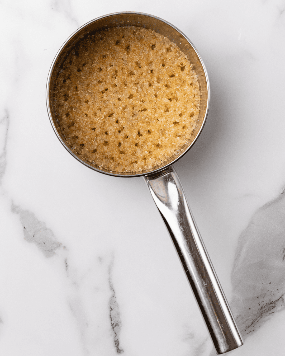 quinoa cooked in a small pot.