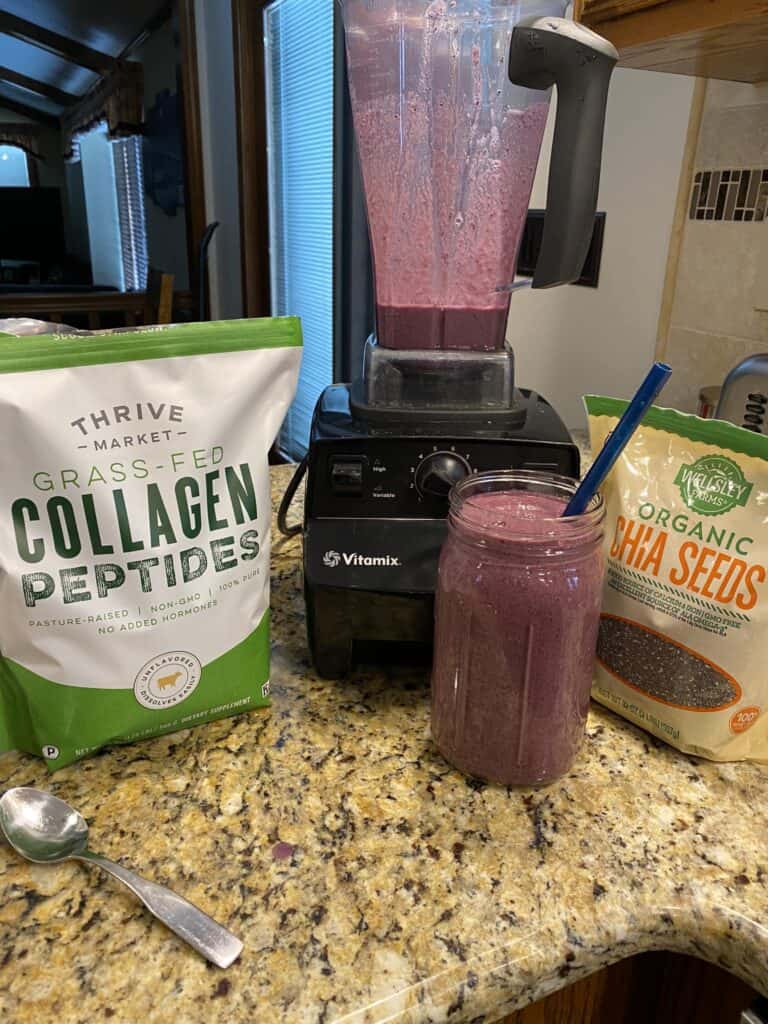 collagen and chia seeds and smoothie in front of a vitamix.