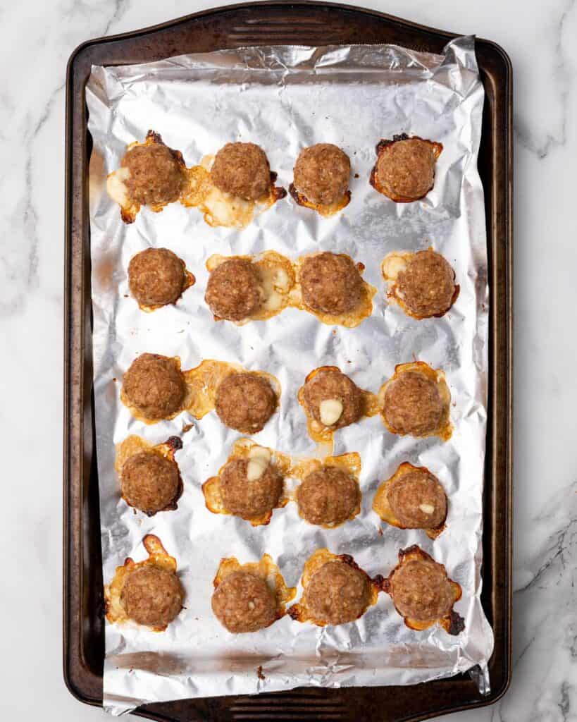 stuffed meatballs cooked on a bking sheet.