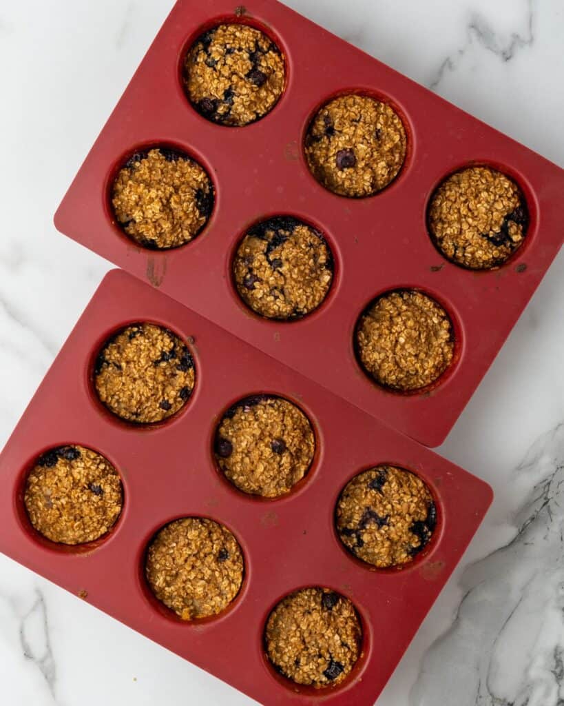 blueberry muffins baked in muffin pan.