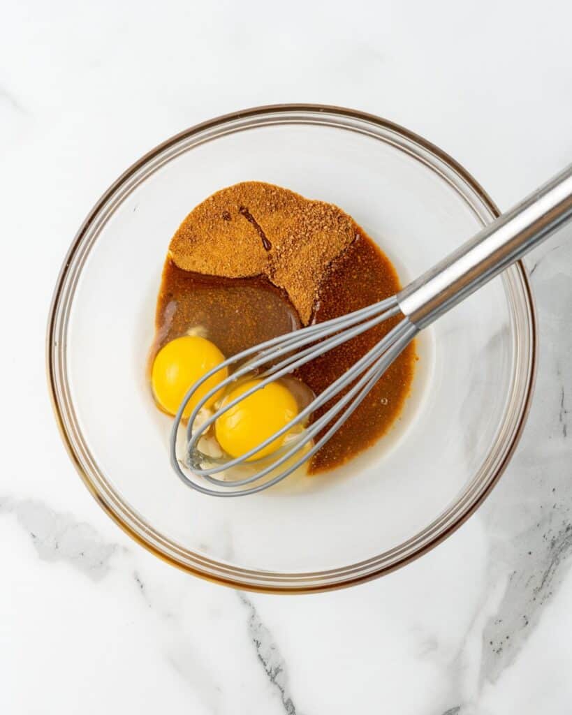 eggs and sugar in a glass bowl.