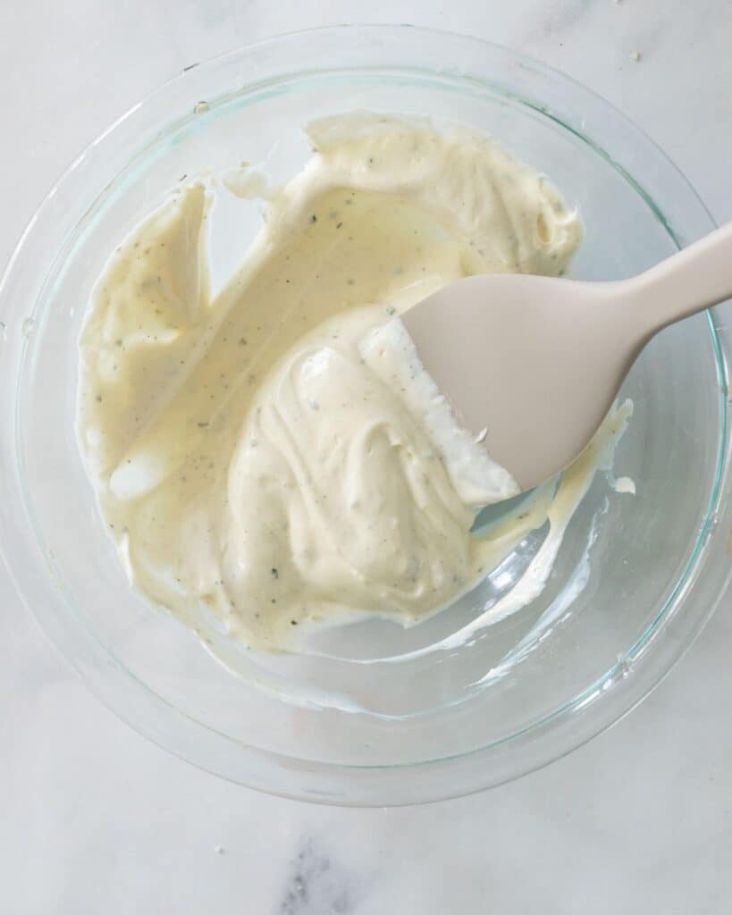 ranch seasoning and sour cream mix in a bowl.
